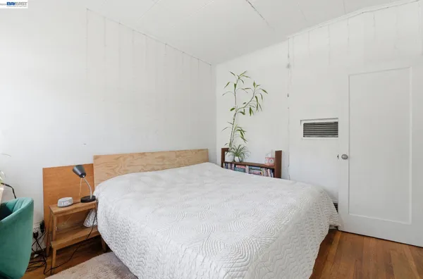 a bedroom with a bed and a table in it