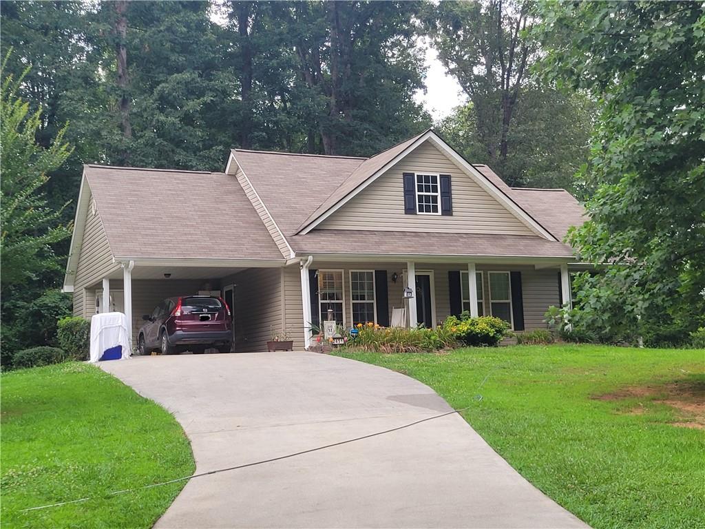 2451 Black Road Cleveland, GA 30528 - Photo 1 of 1 a view of a house with a yard and potted plants