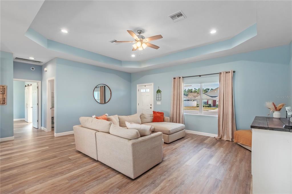 2839 Northeast 43rd Road Ocala, FL 34470 - Photo 12 of 50 a living room with furniture and a wooden floor