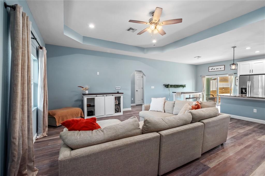2839 Northeast 43rd Road Ocala, FL 34470 - Photo 13 of 50 a living room with furniture and a chandelier