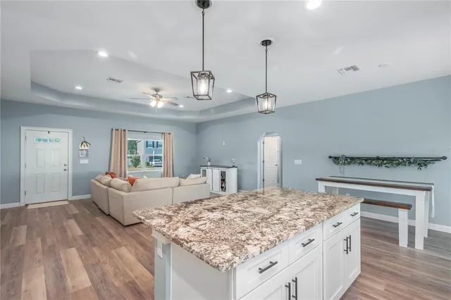 a room with furniture and wooden floor