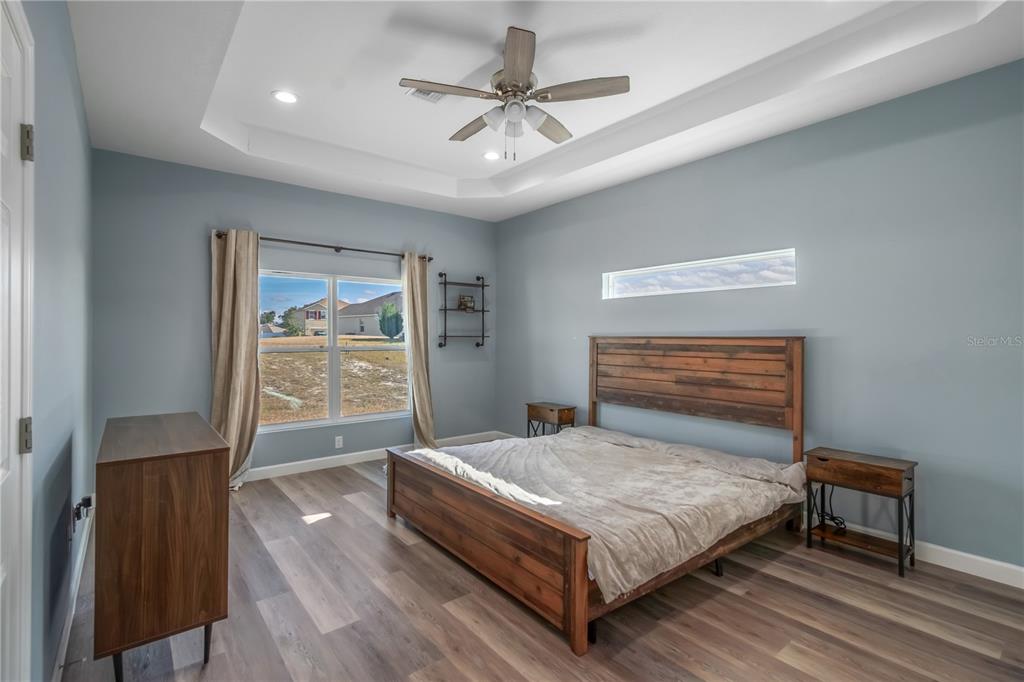 2839 Northeast 43rd Road Ocala, FL 34470 - Photo 22 of 50 a bedroom with a bed and a window