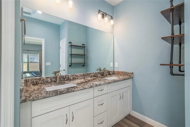 a bathroom with a toilet sink and shower