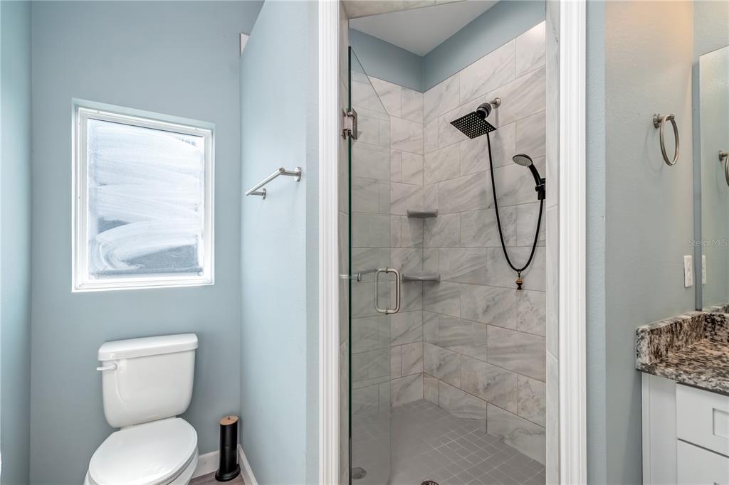 2839 Northeast 43rd Road Ocala, FL 34470 - Photo 27 of 50 a bathroom with a toilet sink and shower