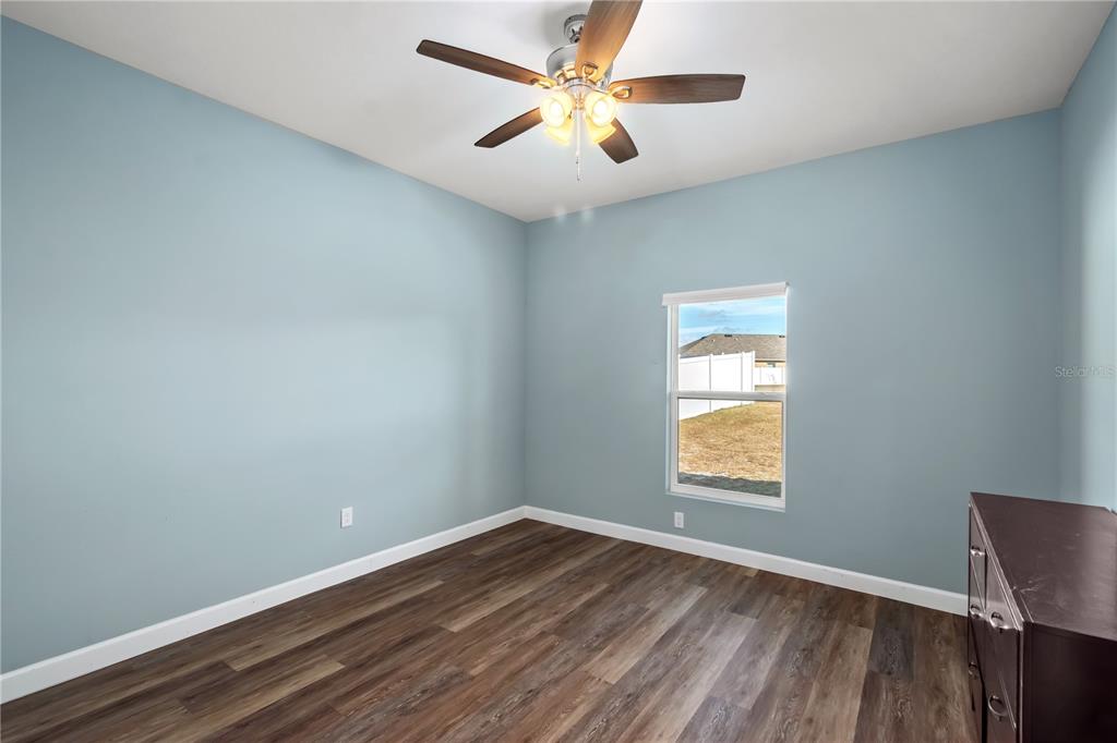 2839 Northeast 43rd Road Ocala, FL 34470 - Photo 29 of 50 wooden floor in an empty room with a window