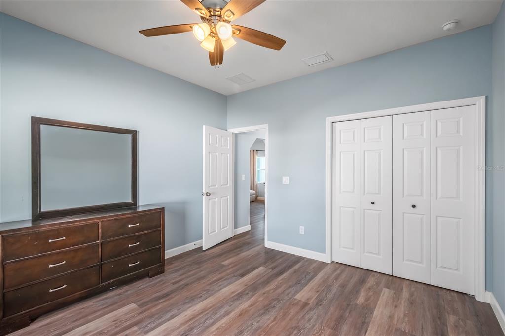 2839 Northeast 43rd Road Ocala, FL 34470 - Photo 30 of 50 an empty room with wooden floor closet and windows