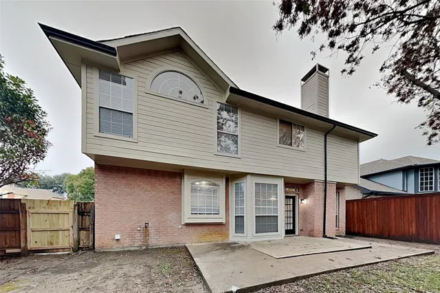 a front view of a house with a garage