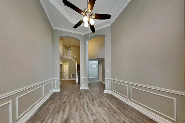 a view of hallway with wooden floor