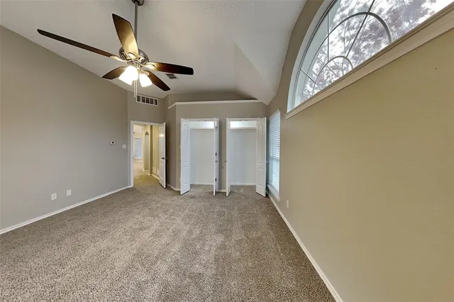 en view of an empty room with a fan