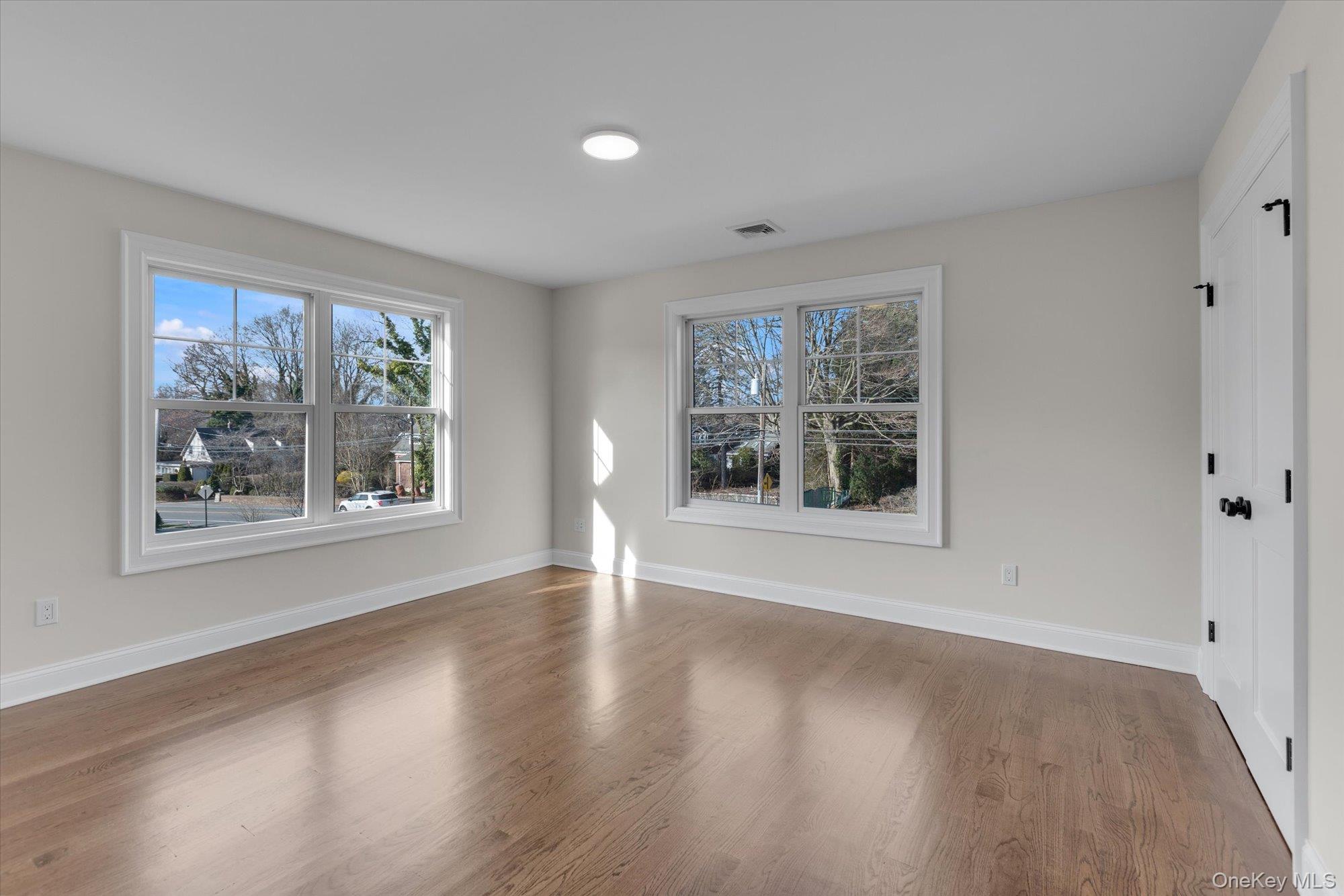 44 North Woodhull Road Huntington, NY 11743 - Photo 17 of 26 Empty room featuring wood finished floors and baseboards
