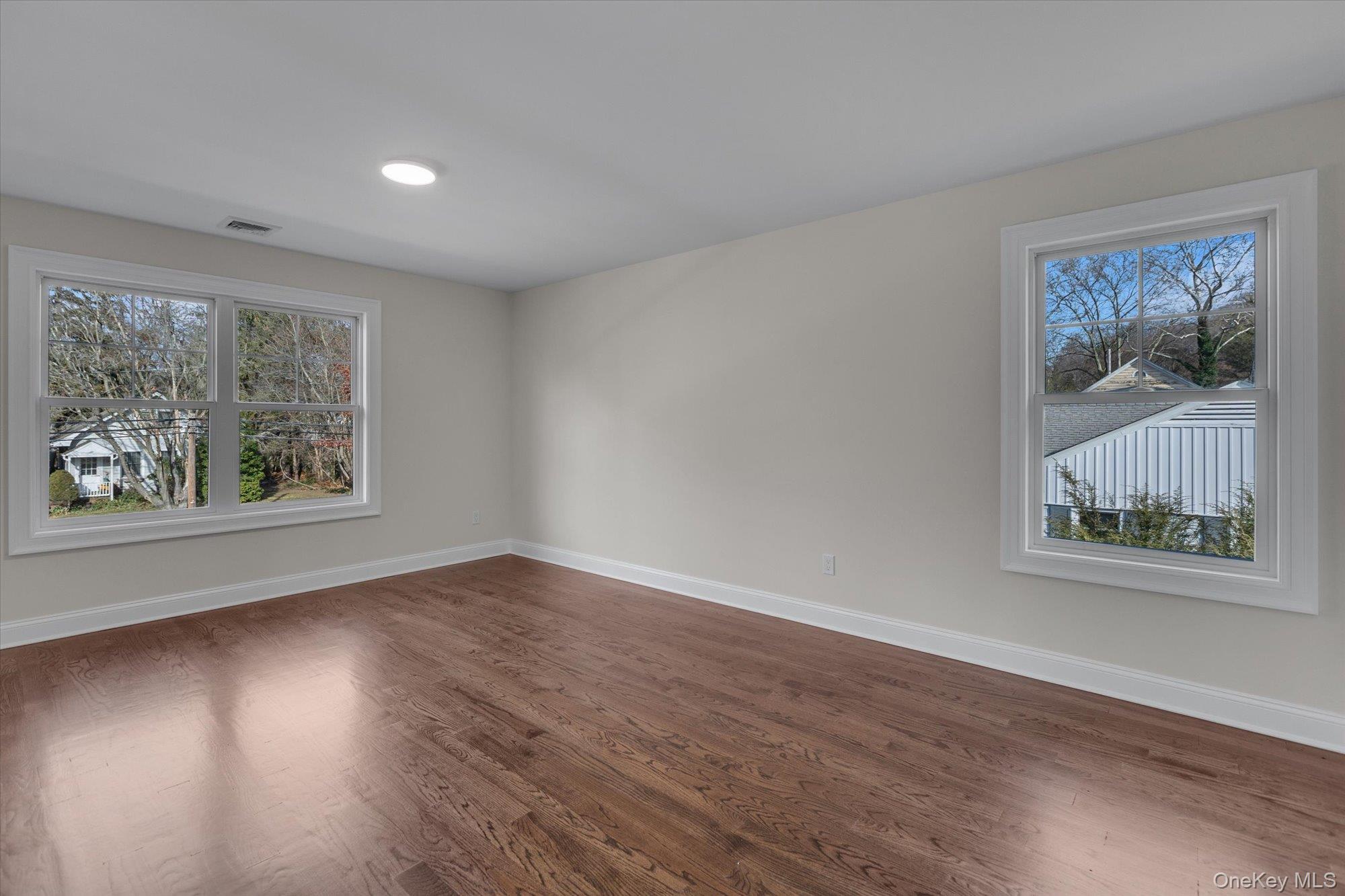 44 North Woodhull Road Huntington, NY 11743 - Photo 19 of 26 Empty room with wood finished floors and baseboards