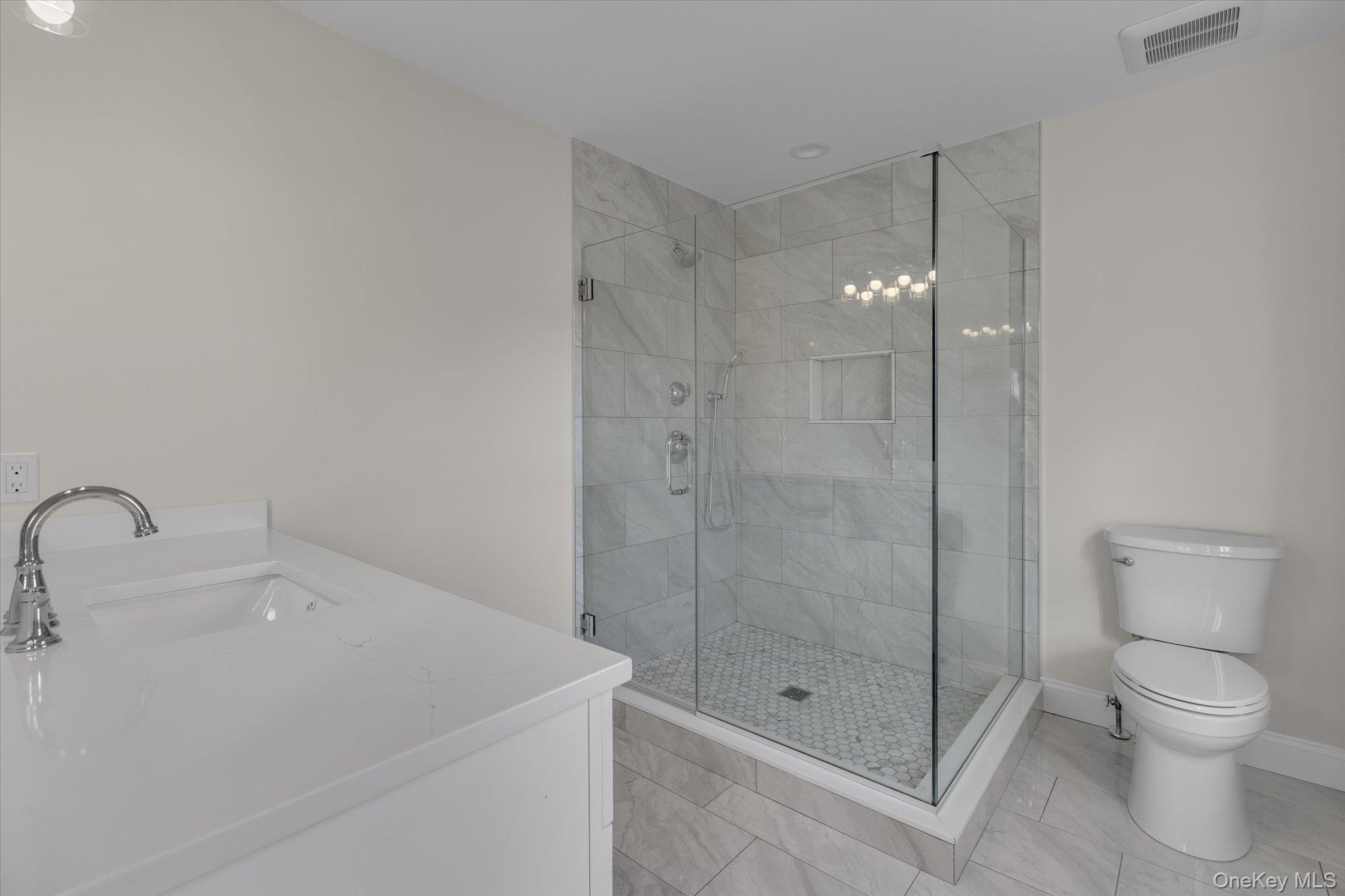 44 North Woodhull Road Huntington, NY 11743 - Photo 23 of 26 Full bathroom with vanity and a shower stall