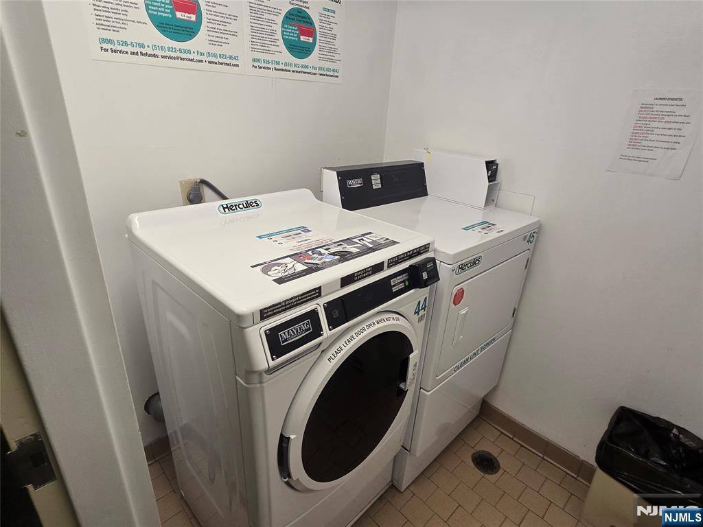 316 Prospect Avenue, Unit 8D Hackensack, NJ 07601 - Photo 11 of 17 a utility room with dryer and washer