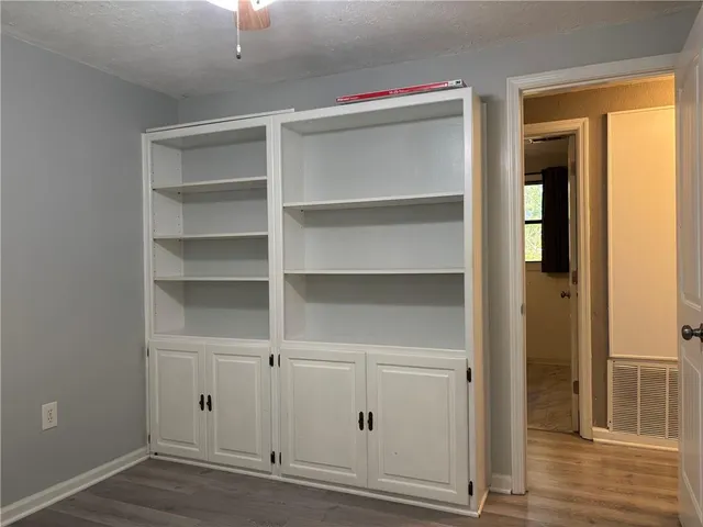 a view of a hallway with closet