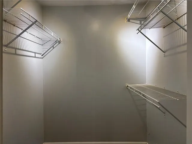 a view of storage and utility room with racks on the wall