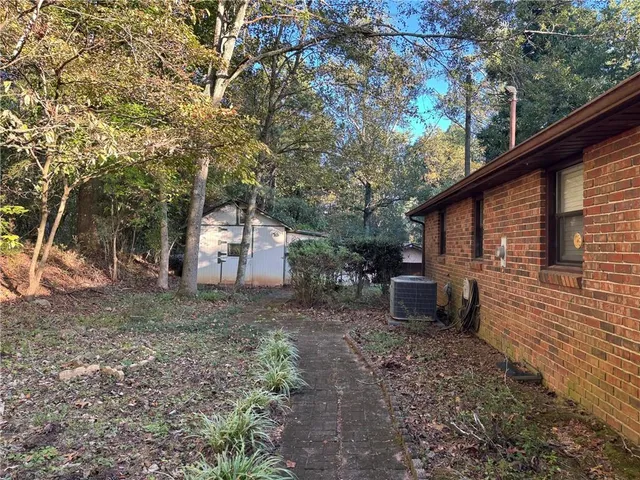 a backyard of a house with lots of green space