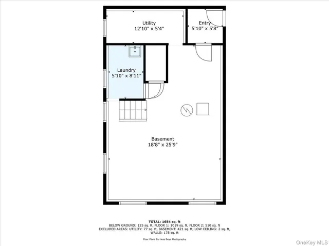 a picture of a bench in front of a wall