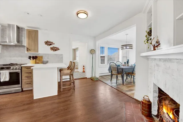 a view of kitchen with furniture and wooden floor