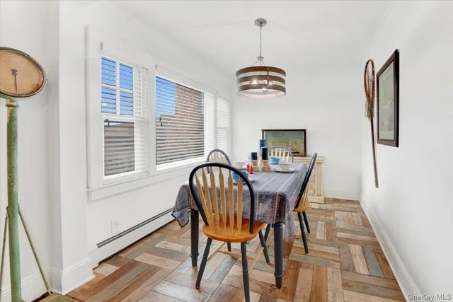 a view of a dining room with furniture wooden floor and window