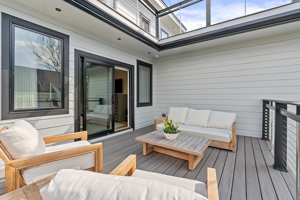 9 Whittlesey Road Newton, MA 02459 - Photo 16 of 33 a view of a two chairs in the balcony