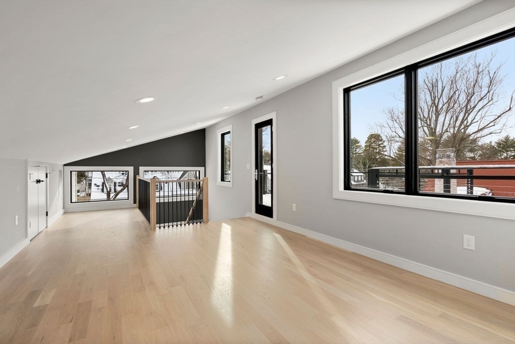 9 Whittlesey Road Newton, MA 02459 - Photo 23 of 33 a view of a big room with windows and chandelier