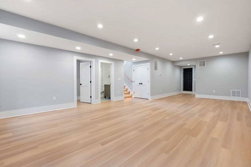 9 Whittlesey Road Newton, MA 02459 - Photo 25 of 33 a view of an empty room with wooden floor
