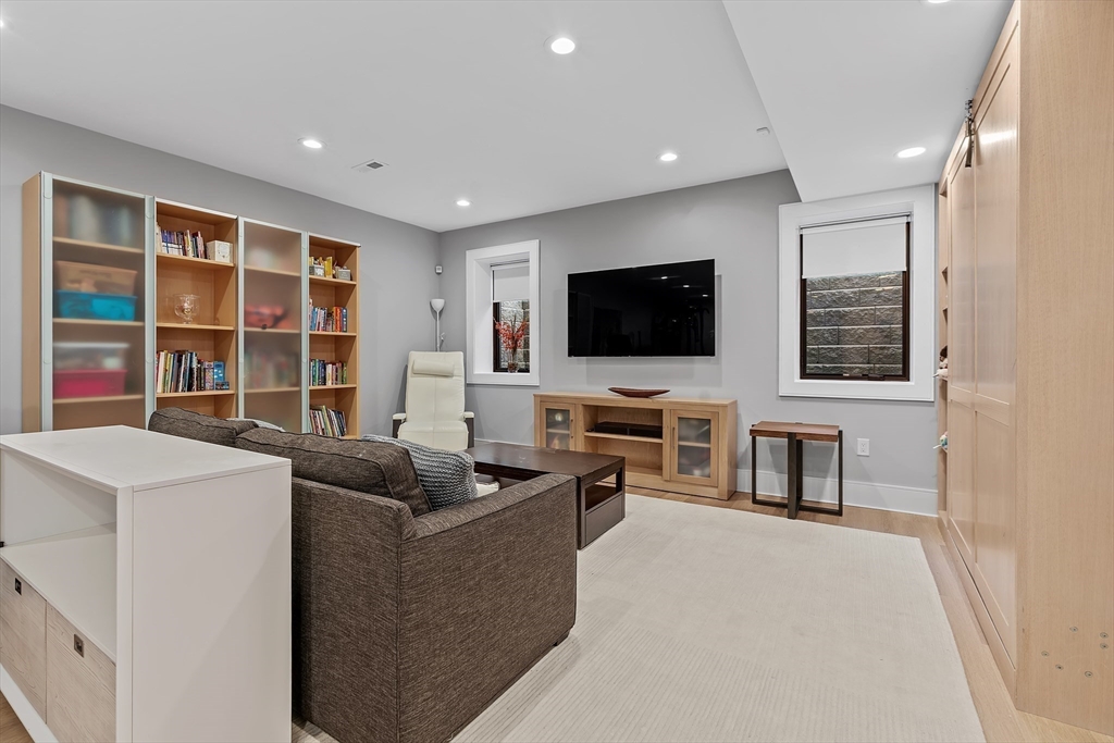 9 Whittlesey Road Newton, MA 02459 - Photo 26 of 33 a living room with furniture and a flat screen tv