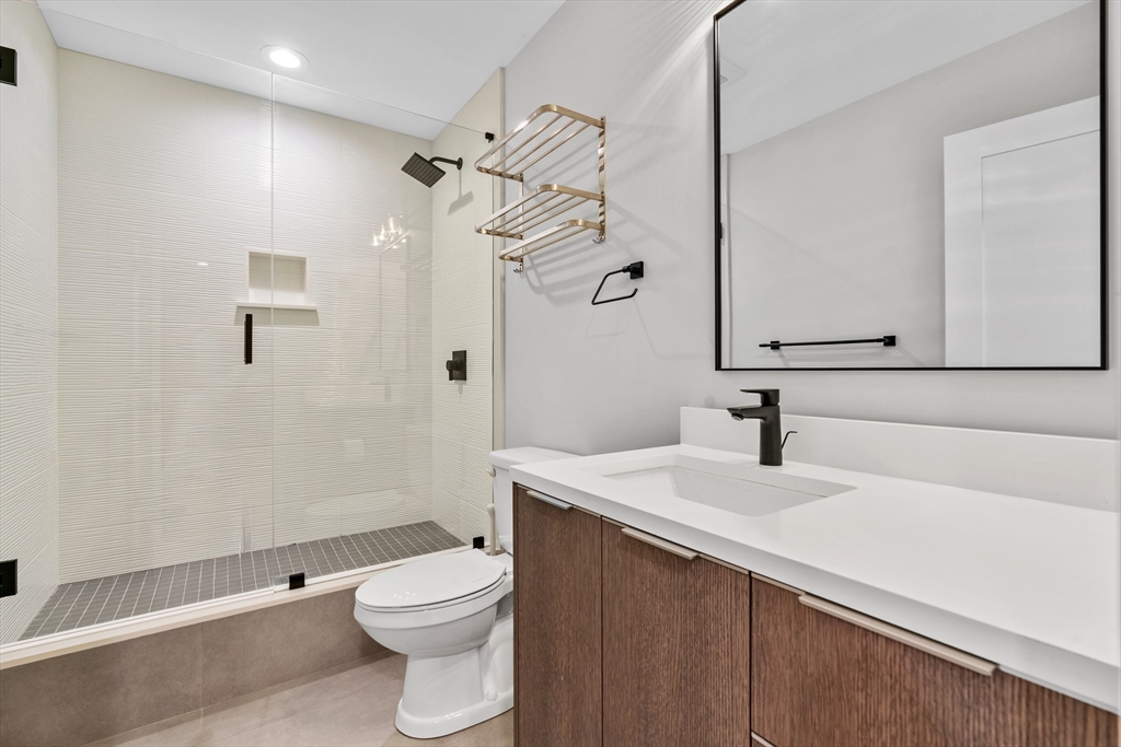 9 Whittlesey Road Newton, MA 02459 - Photo 29 of 33 a bathroom with a sink a toilet and shower