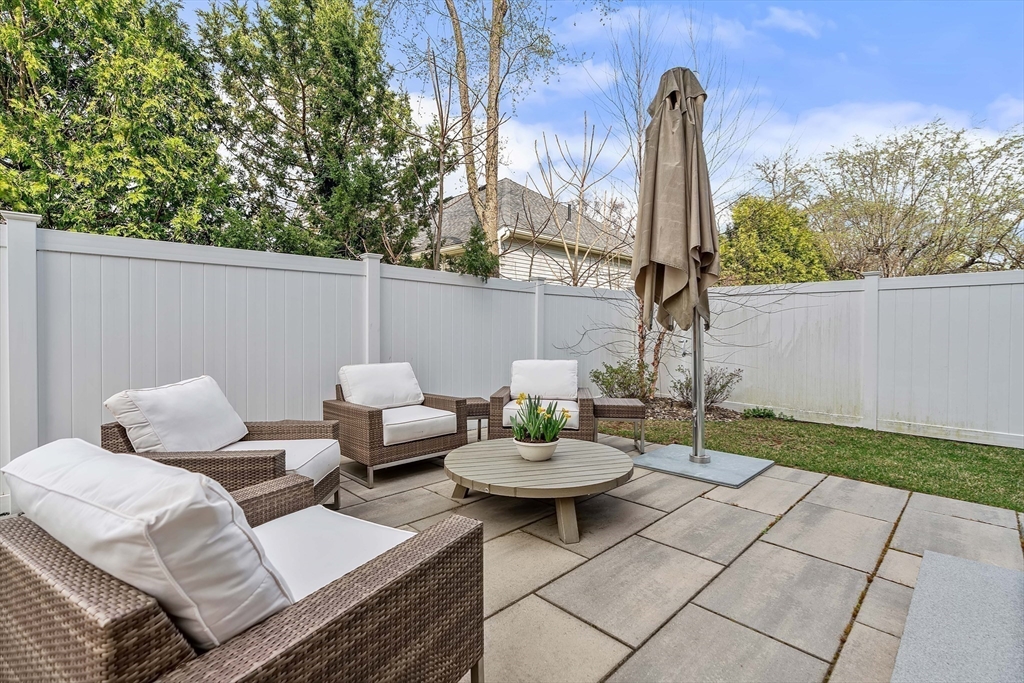 9 Whittlesey Road Newton, MA 02459 - Photo 30 of 33 a couple of chairs sitting in a backyard with a small pool