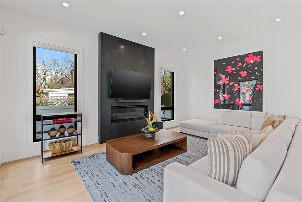 9 Whittlesey Road Newton, MA 02459 - Photo 3 of 33 a living room with furniture and a flat screen tv