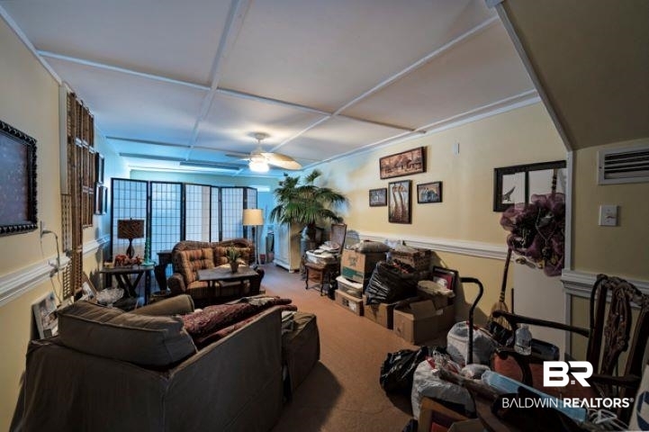 710 South Mobile Street, Unit 52 Fairhope, AL 36532 - Photo 9 of 58 Living area with carpet and a ceiling fan