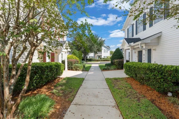 a view of a pathway with a house in the background