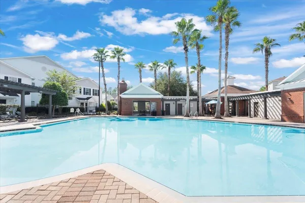 a view of house with a swimming pool