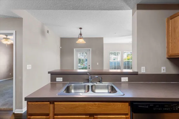 a kitchen with a sink and a window