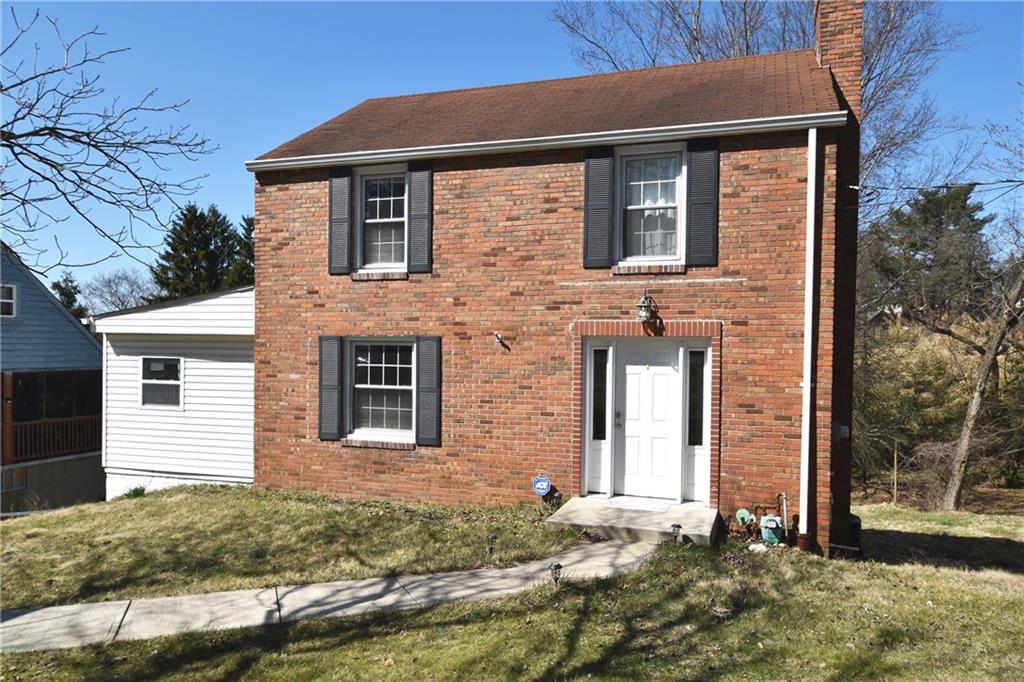 5470 Library Road Bethel Park, PA 15102 - Photo 1 of 24 front view of a brick house with a large windows