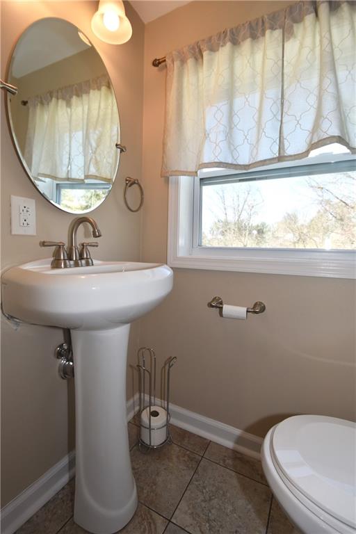 5470 Library Road Bethel Park, PA 15102 - Photo 13 of 24 a bathroom with a toilet a sink and a mirror