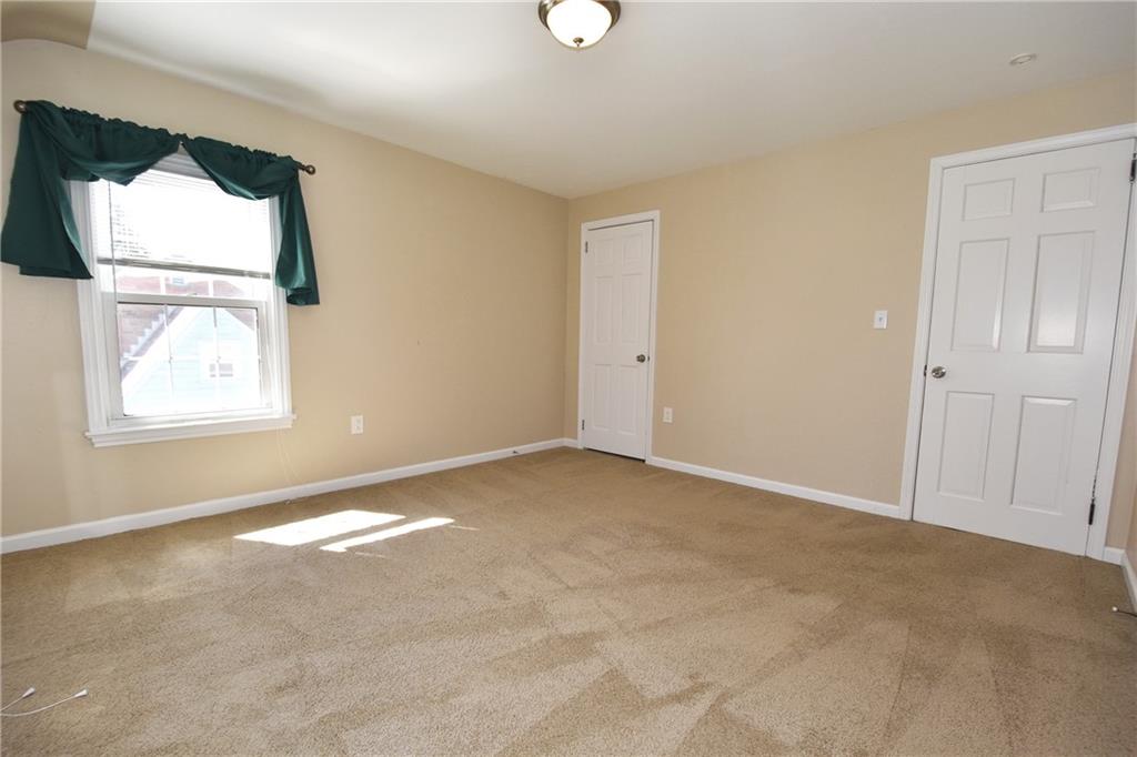5470 Library Road Bethel Park, PA 15102 - Photo 15 of 24 an empty room with windows and mirror
