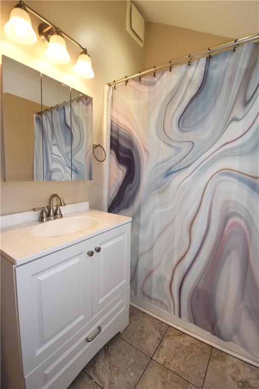 5470 Library Road Bethel Park, PA 15102 - Photo 18 of 24 a bathroom with a sink and mirror