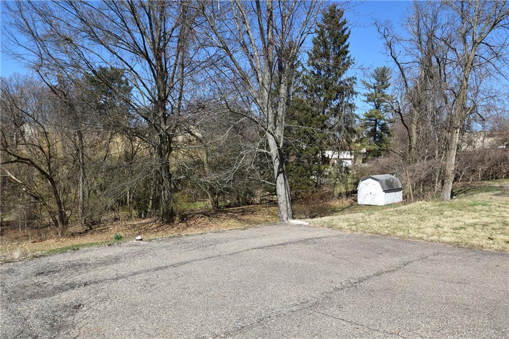 5470 Library Road Bethel Park, PA 15102 - Photo 21 of 24 a view of a yard with a tree