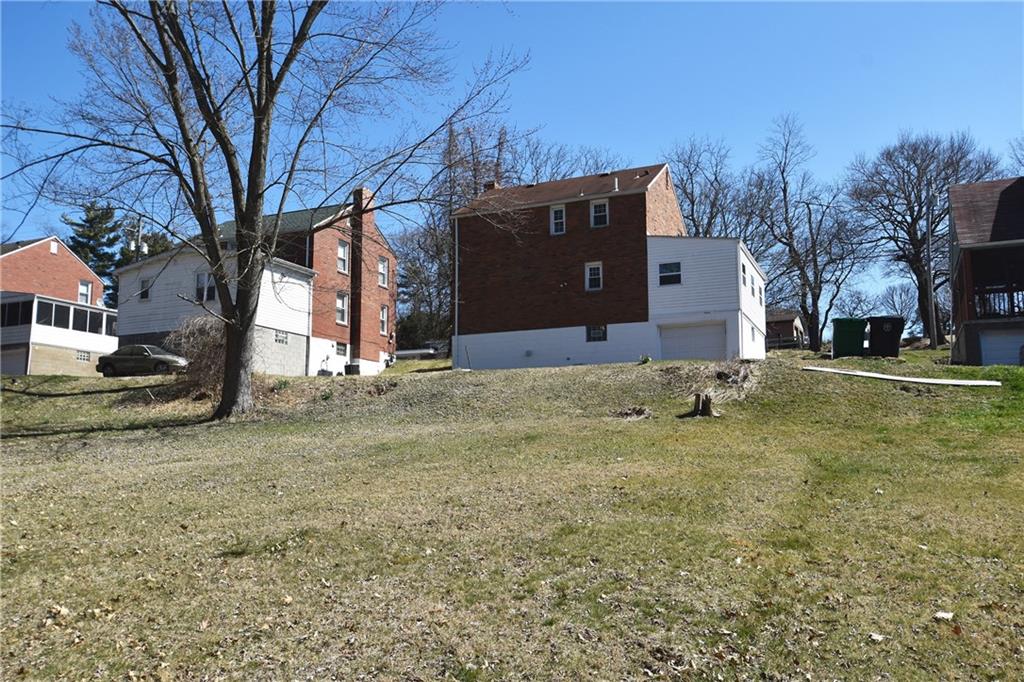 5470 Library Road Bethel Park, PA 15102 - Photo 24 of 24 a house that has a tree in front of it