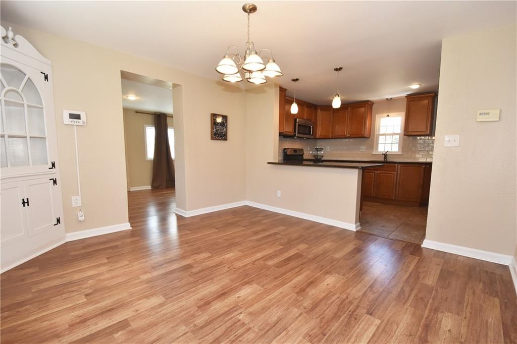 5470 Library Road Bethel Park, PA 15102 - Photo 6 of 24 a view of a kitchen with a sink dishwasher a kitchen counter top and wooden floor