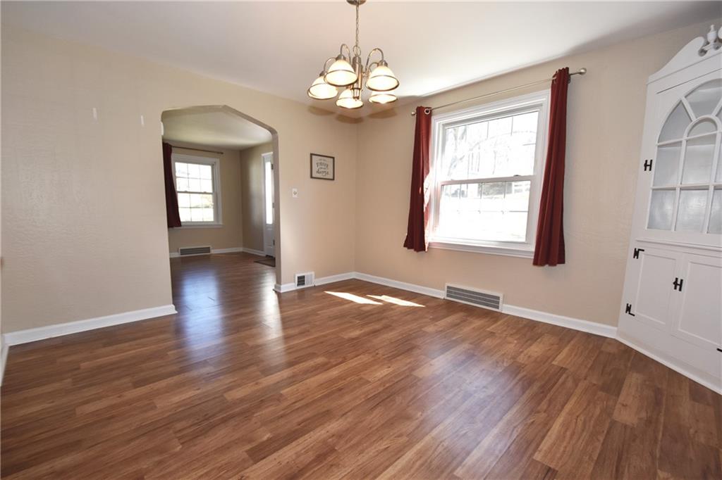 5470 Library Road Bethel Park, PA 15102 - Photo 8 of 24 an empty room with wooden floor and windows