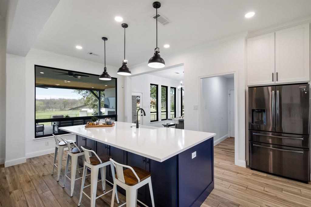 245 Barnes Bridge Road Sunnyvale, TX 75182 - Photo 12 of 40 Laundry room is located off the kitchen near the garage door.