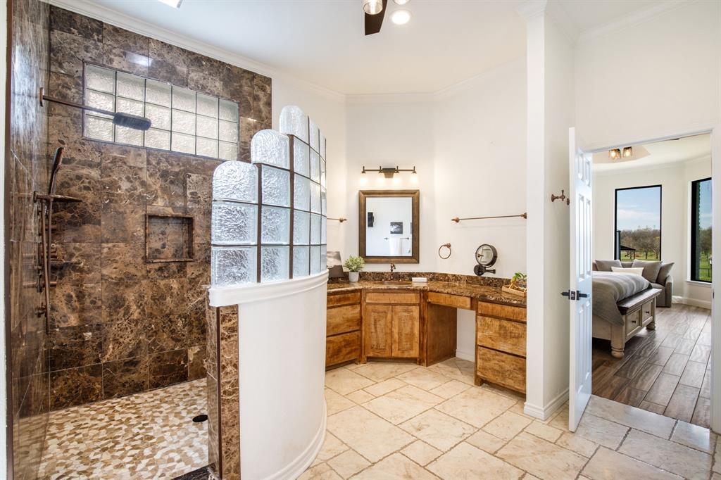 245 Barnes Bridge Road Sunnyvale, TX 75182 - Photo 24 of 40 Luxury spa like shower features a seat, rainfall shower head, body sprayers and a hand held sprayer.