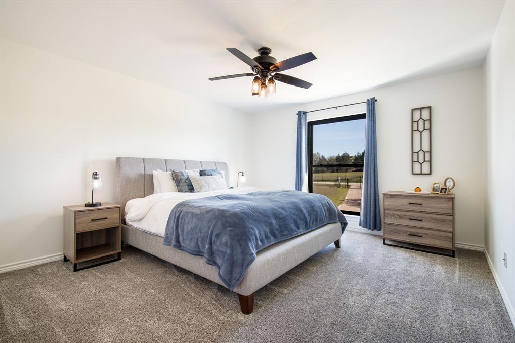 245 Barnes Bridge Road Sunnyvale, TX 75182 - Photo 25 of 40 Second bedroom overlooks the front lawn. This home has extra storage closets and oversized closets.