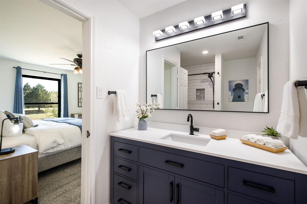 245 Barnes Bridge Road Sunnyvale, TX 75182 - Photo 26 of 40 Ensuite bath for second bedroom also has access from the hall area.