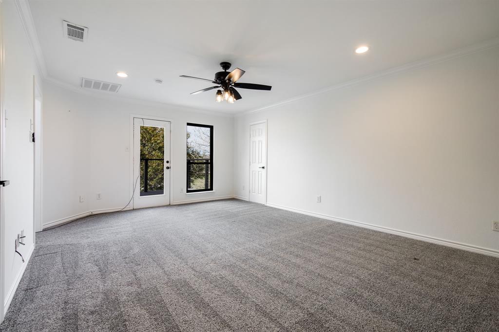 245 Barnes Bridge Road Sunnyvale, TX 75182 - Photo 28 of 40 This upstairs bonus room has two large closets for extra storage with walk-in attic access. Enjoy the views from the balcony.