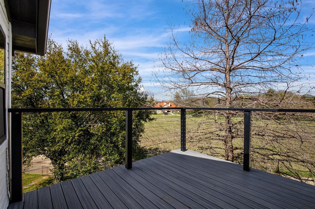 245 Barnes Bridge Road Sunnyvale, TX 75182 - Photo 29 of 40 Morning coffee with a view. Enjoy panoramic vistas of the pool and pasture from your exclusive upper-level retreat.