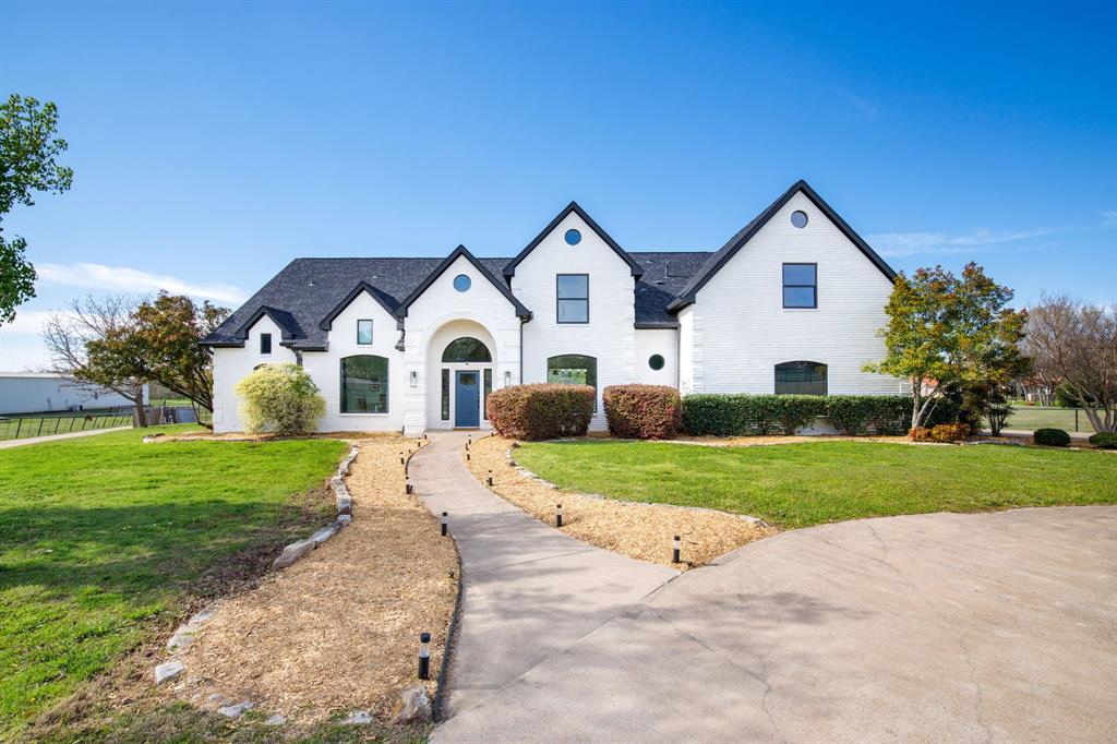245 Barnes Bridge Road Sunnyvale, TX 75182 - Photo 3 of 40 2021-2022 renovations included a new roof, new windows and fresh exterior paint.