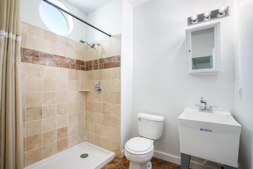 245 Barnes Bridge Road Sunnyvale, TX 75182 - Photo 31 of 40 Third full bath is located in the garage. This space is perfect for showering after outdoor activities or doubling as a convenient pet wash station.